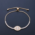 Verstellbares Evil Eye Armband in Gold mit mikro-gefassten AAA Zirkonia Kristallen - Gold