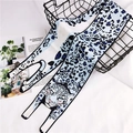Detail of long silk scarf with leopard print and cartoon cat head on white background - Blue Leopard / 120cm
