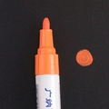 Orange paint marker with bullet tip for high coverage writing on dark surfaces - Orange