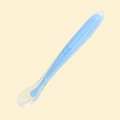 Light blue silicone baby feeding spoon with embossed heart pattern on the handle - Blue