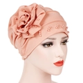 Close-up of the powder pink turban cap with handmade 3D flowers and pearl bead details - Korean Pink