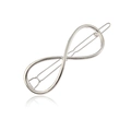 Vue détaillée de la barrette en métal argenté poli avec un design de symbole infini élégant - Argenté