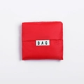 Foldable red Oxford cloth shopping bag in compact square pouch with BAG label - Red