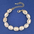 Eleganteres champagnerfarbenes Kristallarmband mit Goldbeschichtung und Verschluss - Marineblau