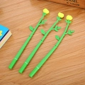 Three creative gel pens with green stems and yellow flower toppers on a wood desk - Green Stem - Yellow Rose / 0.5mm Black Gel Pen
