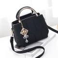 Black quilted handbag with gold metal handle and embroidery for women - Black