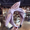 Pink fabric headband with a large bow design and textured material for women - Pink