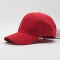 Side view of a red cotton twill baseball cap with curved brim and adjustable strap - Red
