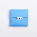 Sky blue portable folding shopping bag in compact square shape with BAG label - Sky Blue