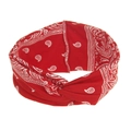 Close-up of red bohemian paisley headband featuring a twisted knot and vintage floral print - Red