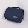 Minimalist navy blue travel toiletry bag with white icons on a clean background - Navy Blue