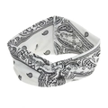 Close-up of white bohemian headband featuring black paisley print and twist knot design - White