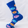 Blue crew sock with colorful donut patterns on a foot model with white background - EU 41-46 / Blue (Donut Pattern)