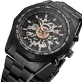 Macro detail of automatic mechanical watch with skeleton dial and tachymeter bezel - Black with Gold Movement