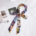 Polka dot skinny silk scarf tied in a bow with colorful geometric and floral patterns - Colorful Leaves