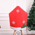 Detail of Christmas snowflake chair cover with holly leaf on a modern dining chair - Non-woven Snowflake Chair Cover