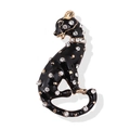 Elegant black enamel panther brooch with sparkling crystals and gold accents on white base - Black