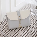 Mini bicolor PU leather crossbody bag in grey and beige with a gold deer pendant charm - Light Gray