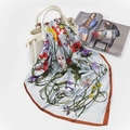 Light blue floral satin silk square scarf with orange borders draped on a handbag - FJ124-Grey