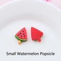 Close-up of small resin watermelon popsicle charms on a white ceramic plate - Small Watermelon Popsicle 18*23mm / 18*23mm
