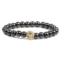 Handmade beaded magnetic hematite bracelet featuring a gold lion head charm on white background - Gold Lion Head / Black