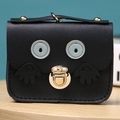 Front view of black cartoon owl coin purse in PU leather with gold metal clasp detail - Black