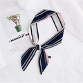 Elegant navy blue striped skinny silk scarf tied as a stylish accessory on a white fabric - 19 Vertical Stripe Pink