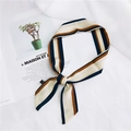 Beige silk scarf with navy and brown stripes tied on a magazine in a stylish setting - 9 Vertical Stripes Green Yellow