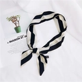 Elegant black and white striped skinny silk scarf tied in a bow on a lifestyle magazine - 21 Rhombus Chain