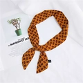 Orange paisley print skinny silk scarf in 100% polyester tied in a loose knot - 16 Paisley Yellow