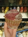 Close-up of a sparkling cupcake-shaped evening bag featuring pink and silver crystal rhinestones - Rose Purple