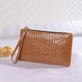 Brown crocodile embossed wristlet clutch bag with gold zipper and minimalist strap - Brown