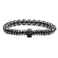 Bracelet punk en perles d'hématite avec crâne en cuivre et yeux en zircon rouge sur fond blanc - Noir avec Entretoise