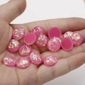 Close-up of 12mm pink synthetic opal resin cabochons with iridescent glitter flakes - Pink with Iridescent Flakes (9)