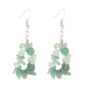 Detailed view of handmade triangular earrings with light green natural stone chips - Green Aventurine