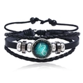 Macro detail of multi-layer Capricorn constellation leather bracelet with woven cords - Capricorn