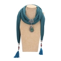 Deep green scarf with peacock pendant and green gemstone tassels on a mannequin - Turquoise Green