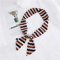 Brown and navy herringbone skinny silk scarf tied as a stylish hair accessory - 10 Wave Pink