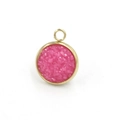 Macro view of a round gold stainless steel charm with pink resin druzy crystal inlay - Nude Pink(17)
