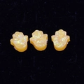 Macro shot of three synthetic orange opal Hamsa hand charms for DIY jewelry making - Hamsa Hand No Hole / Yellow