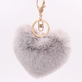 Macro detail of a plush grey heart-shaped faux fur keychain with a golden metal clasp - Light Gray / Silver Circular Single-ring Buckle