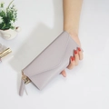 Long mauve envelope wallet for women with heart pendant and tassel detailing - Purple