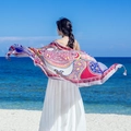 Ethnic style floral cotton scarf with tassels shown against a beach background - 180cm / Colorful Print Tassel Beach Style (L110)