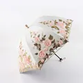 Dreifach gefalteter Spitzenschirm mit rosa 3D-Blumenstickerei und goldene Pailletten - Dreifach gefaltet / Aprikosengelb