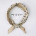 Khaki square scarf with white paisley pattern tied and folded on white background - Paisley Beige