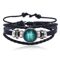 Detailed view of multilayer woven leather Pisces constellation bracelet with blue charm - Pisces