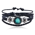 Detailed view of layered woven leather bracelet with luminous Virgo glass charm - Virgo