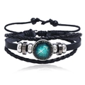 Detail of multi-layer leather bracelet with glowing Sagittarius zodiac glass cabochon - Sagittarius