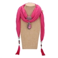 Pink ethnic scarf necklace featuring a peacock pendant and tassels on a mannequin - Rose Red