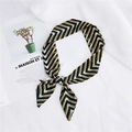 Elegant geometric V-pattern silk scarf in black and ginger yellow for hair or bag handles - 25 Twist Green